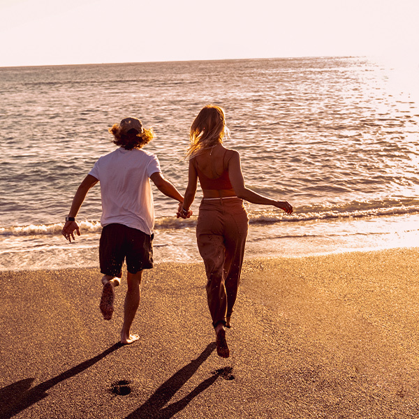 Couple running in the Corralejo dunes