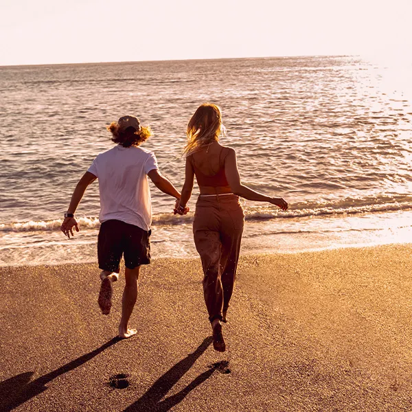 Couple running in the Corralejo dunes