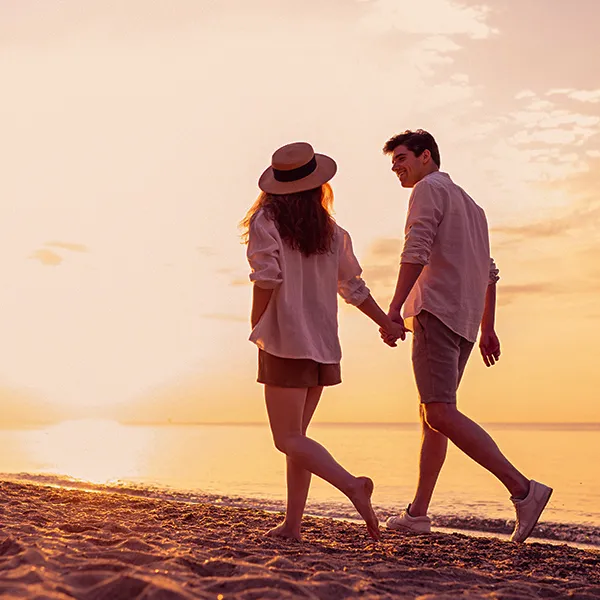 Couple walking along the beach on the Costa del Sol